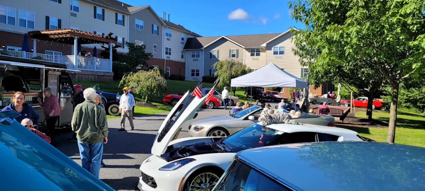 Outdoor car show with sports and classic cars